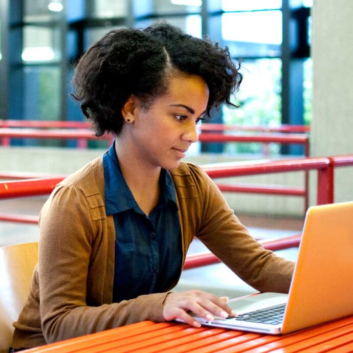 African American student with laptop